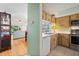 Galley kitchen with stainless steel appliances and wood cabinets at 608 N Jefferson Ave # 30, Sarasota, FL 34237