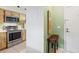 Kitchen entry with stainless steel appliances and wood cabinets at 608 N Jefferson Ave # 30, Sarasota, FL 34237