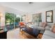 Living room features hardwood floors, couches, and access to a private patio at 608 N Jefferson Ave # 30, Sarasota, FL 34237