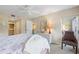 Comfortable bedroom with a king-size bed and balcony access at 6713 Stone River Rd # 104, Bradenton, FL 34203