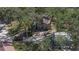 Aerial view of house, garage, and surrounding trees at 6919 Fish Farm Rd, Palmetto, FL 34221