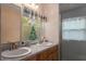 Double vanity bathroom with a shower and window at 6919 64Th E Ave, Palmetto, FL 34221