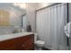 Updated bathroom features a vanity with a large mirror and shower/tub combo at 6919 64Th E Ave, Palmetto, FL 34221