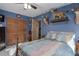 Blue bedroom with double bed and wood closet doors at 6919 64Th E Ave, Palmetto, FL 34221
