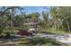 Covered parking for a boat and car, near lush greenery at 6919 64Th E Ave, Palmetto, FL 34221