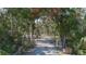 Long private driveway leading to a home with a gate at 6919 64Th E Ave, Palmetto, FL 34221
