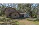 Two-story tan house with covered porch and landscaping at 6919 64Th E Ave, Palmetto, FL 34221