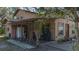 Two-story tan house with covered porch and landscaping at 6919 64Th E Ave, Palmetto, FL 34221