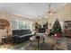 Bright living room with large windows, comfortable seating and a Christmas tree at 6919 64Th E Ave, Palmetto, FL 34221