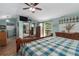 Main bedroom with a king-size bed and access to a deck at 6919 64Th E Ave, Palmetto, FL 34221