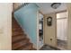 Wood staircase with a light blue wall and view of hallway at 6919 64Th E Ave, Palmetto, FL 34221