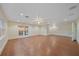 Living room with French doors, wood-look tile floors, recessed lighting, and ceiling fan at 7056 Saddle Creek Ln, Sarasota, FL 34241