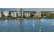 Aerial view of waterfront condo building with boaters nearby at 707 S Gulfstream Ave # 604, Sarasota, FL 34236