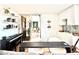 Stylish dining area with a sleek black table and modern chairs, adjacent to a music area at 707 S Gulfstream Ave # 604, Sarasota, FL 34236