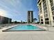 Community pool with surrounding lounge chairs at 707 S Gulfstream Ave # 604, Sarasota, FL 34236