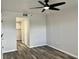 Bright bedroom with ceiling fan and wood-look flooring at 7301 29Th Avenue W Dr # 206, Bradenton, FL 34209