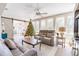 Sunroom with gray couches, a Christmas tree, and a wood ceiling at 7402 Westmoreland Dr, Sarasota, FL 34243