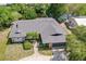 Single-story home with gray garage door and dark roof at 7707 10Th Nw Ave, Bradenton, FL 34209