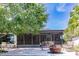 Screened patio with fire pit and comfortable seating area at 7707 10Th Nw Ave, Bradenton, FL 34209