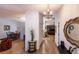 Bright and spacious entryway with hardwood floors and views into the living and dining areas at 7707 10Th Nw Ave, Bradenton, FL 34209