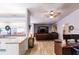 Kitchen boasts white cabinets, granite countertops, and a view into the living area at 7707 10Th Nw Ave, Bradenton, FL 34209