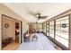 Relaxing screened porch with tiled floors and seating area at 7707 10Th Nw Ave, Bradenton, FL 34209