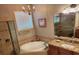 Elegant bathroom with corner soaking tub, granite vanity, and shower at 9008 Willowbrook Cir, Bradenton, FL 34212