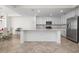 Modern kitchen with stainless steel appliances and a large island at 920 Tidewater Shores Loop # 202, Bradenton, FL 34208