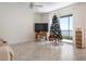 Living room featuring a Christmas tree and water view at 920 Tidewater Shores Loop # 202, Bradenton, FL 34208