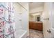 Bathroom with shower/tub combo and wood vanity at 1010 Southern Pine Ln, Sarasota, FL 34243