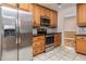 Stainless steel appliances and wood cabinets in this kitchen at 1010 Southern Pine Ln, Sarasota, FL 34243