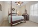 Charming bedroom with a four-poster bed and dresser at 11528 28Th Street E Cir, Parrish, FL 34219