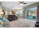 Relaxing living room with sliding glass doors leading to the pool area at 11528 28Th Street E Cir, Parrish, FL 34219