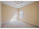 Spacious bedroom featuring a ceiling fan and window with blinds at 11634 Piedmont Park Xing, Bradenton, FL 34211