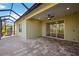 Covered patio with sliding glass doors and paver tile flooring, perfect for outdoor relaxation at 11634 Piedmont Park Xing, Bradenton, FL 34211