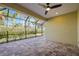 Relaxing screened patio with paver tile floor and ceiling fan, great for outdoor living at 11634 Piedmont Park Xing, Bradenton, FL 34211