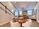 Living room with vaulted ceiling, large TV, and comfortable seating at 11733 Meadowgate Pl, Bradenton, FL 34211