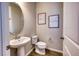 Clean powder room with pedestal sink and toilet at 11733 Meadowgate Pl, Bradenton, FL 34211