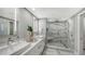 Modern bathroom with double vanity and walk-in shower at 1211 Gulf Of Mexico Dr # 108, Longboat Key, FL 34228