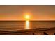 Spectacular sunset over the ocean and sandy beach at 1211 Gulf Of Mexico Dr # 108, Longboat Key, FL 34228