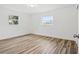 Simple bedroom with wood-look floors and neutral walls at 1310 Rosery Ne Rd, Largo, FL 33770