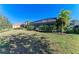Spacious backyard with screened-in patio and lush green grass at 1387 Still River Dr, Venice, FL 34293