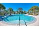 Inviting community pool with a slide and shaded seating area at 1387 Still River Dr, Venice, FL 34293