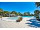 Community pool with a shallow entry and shaded cabanas at 1387 Still River Dr, Venice, FL 34293