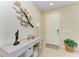 Inviting home entryway with a white door and decor at 1387 Still River Dr, Venice, FL 34293