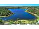 Aerial view of the serene community lake and walking paths at 1387 Still River Dr, Venice, FL 34293