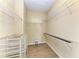 Large walk-in closet with built-in wire shelving and drawers at 1387 Still River Dr, Venice, FL 34293