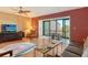 Bright living room with comfy seating and access to balcony at 1601 Bayhouse Point Dr # Ba204, Sarasota, FL 34231