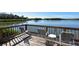 Waterfront seating area with chairs and table at 1601 Bayhouse Point Dr # Ba204, Sarasota, FL 34231