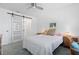 Main bedroom with barn door, light wood dresser, and a comfortable bed at 1708 Glenhouse Dr # 413, Sarasota, FL 34231